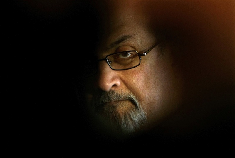 British author Salman Rushdie poses for photographers during a photocall before his news conference at Asia house in Barcelona