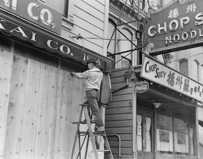 San Francisco, California. With the the owner scheduled to be evacuated, a store front is boarded o . . .