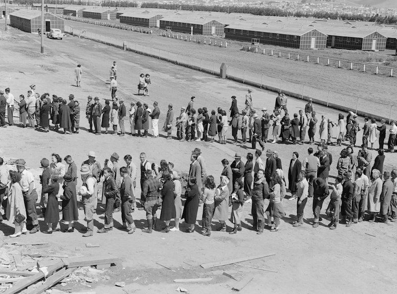 San Bruno, California. This assembly center has been open for two days. Bus-load after bus-load of . . .