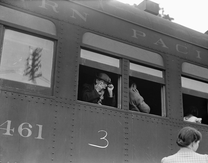 Woodland, Yolo County, California. Ten cars of evacuees of Japanese ancestry are now aboard and the . . .