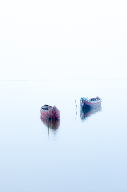 Fishing boats in the mist